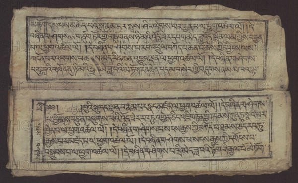 Buddhist text - Formula of repentance Tib. sdig bshags gser gyi spu gri bzhugs so, unknown author, Buddhist art, Tibetan, graphic prints, Book in the Tibetan pecha style, xylographic print in the disciple script dbu can, 16 folios, folio numbering 2-15 recto, first verso, print on thin handmade paper with clear translucency, 19th century, Tibet, graphic, width 25.5 cm, height 7.8 cm, A worn rectangular sheet with a dark background shows two horizontal framed panels separated by a narrow blank space; the upper panel is positioned toward the top edge and the lower panel toward the bottom edge, each framed by thin dark lines and containing dense dark markings that form repeating linear patterns. The paper has an aged, uneven texture with visible creases and slight tears along the edges, and areas of darker discoloration and faint smudging. The dominant colors are beige and tan of the paper, dark brown to black of the framed lines and markings, and hints of gray and faded brown in the worn...