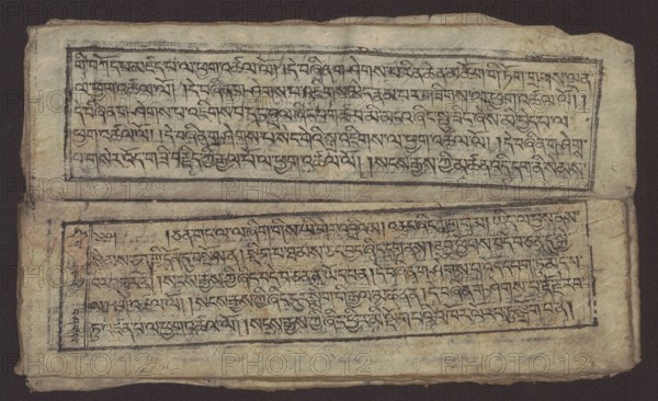 Buddhist text - Formula of repentance Tib. sdig bshags gser gyi spu gri bzhugs so, unknown author, Buddhist art, Tibetan, graphic prints, Book in the Tibetan pecha style, xylographic print in the disciple script dbu can, 16 folios, folio numbering 2-15 recto, first verso. Print on thin handmade paper, clear translucency. 19th century, Tibet. Graphic. Width 25.5 cm, height 7.8 cm., A rectangular aged paper sheet with a dark background contains two horizontal framed blocks filled with closely spaced script-like markings; the paper shows a textured, fibrous surface with creases and worn edges. The top block sits near the upper edge and the bottom block is separated by a horizontal fold; both blocks are outlined by dark hand-drawn borders that are irregular and slightly faded. The page color is a muted beige to light tan with darker brown spots and areas of discoloration; the ink used for the markings and borders is dark brown to black, appearing uneven and smudged in places. The sheet cor...