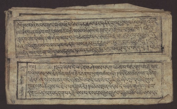 Buddhist text - Formula of repentance Tib. sdig bshags gser gyi spu gri bzhugs so, unknown author/graphic artist, Buddhist art, Tibetan, graphic prints, Book in the Tibetan pecha style, xylographic print in the disciple script dbu can, 16 folios folio numbering 2–15 recto, first verso, print on thin handmade paper with clear translucency, 19th century, Tibet, graphic, width 25.5 cm, height 7.8 cm, An aged rectangular sheet rests against a dark background, showing a worn, textured surface in shades of beige, tan, and light brown with darker browning at the edges; two horizontal framed blocks occupy the sheet, each containing rows of dense, dark ink markings arranged uniformly across the interior of the frames; the ink appears black to dark brown and shows variable intensity with some faded and smudged areas; the paper has creases, small tears, and uneven, slightly frayed edges, with a few darker spots and stains scattered across the surface; thin black border lines surround each framed ...