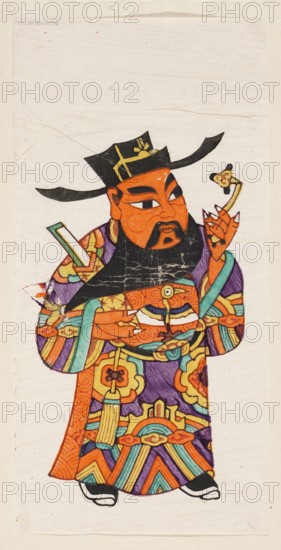 Menshen Gate Guardian, Chinese, nianhua New Year's picture, early 20th century, Jiajiang, graphic print, height 29.0 cm, width 16.0 cm, Menshen Gate Guardian iconography, A colorful illustration of a standing figure wearing a tall black hat with wide side flaps and gold markings, a dark beard, and an orange face with prominent black eyebrows and mustache; the figure holds a small object in one hand and a rectangular item in the other, and wears an ornate robe decorated with swirling and geometric patterns in purple, orange, teal, yellow, green, and black, with visible layered sleeves, tassel-like ornamentation, and patterned footwear, all set against a light beige, slightly textured background.