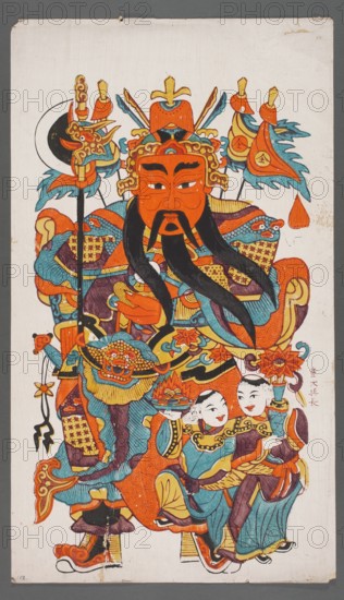 Menshen — the gate guardian with deities He He; creator, protective deities iconography; Chinese; Chinese art; Menshen the gate guardian iconography; graphic print nianhua, New Year's picture; early 20th century; Jiajiang, China; graphic; height 71.0 cm, width 41.0 cm., A colorful painted figure occupies most of the vertical image, wearing ornate armor and a large headdress with decorative elements. The central face is orange with black facial hair and expressive eyebrows, and long black mustaches or beard strands extend downward. Surrounding the figure are patterned garments and accessories in bright orange, teal blue, yellow, and purple, with details in black and small areas of white. A crescent-shaped black and white element appears near the upper left of the headdress, and several flag-like ornaments with teal blue and orange shapes extend from the top. Near the lower right are two smaller human figures with pale faces wearing teal blue and orange clothing, holding floral or decora...