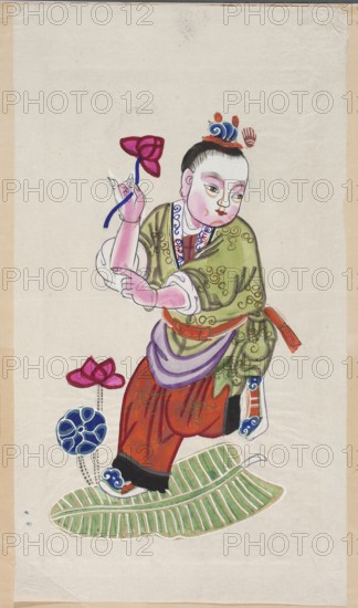 Menshen Gate Guardian in the form of a boy on an artemisia leaf;, artemisias; Chinese; Menshen Gate Guardian iconography; Chinese art; nianhua, New Year's picture; early 20th century; Mianzhu; graphic print; height 51.0 cm, width 29.0 cm, A painted figure of a childlike person with pale pink skin and black hair styled into a topknot, wearing a head ornament in blue and orange and a green patterned robe with white cuffs and a purple sash, paired with red pants and black-trimmed shoes; the figure holds a pink flower tied with a blue ribbon in one hand and stands with one foot on a large green leaf, while a few stylized flowers in pink and blue appear near the leaf; the background is an off-white paper with beige borders and some visible creases and slight discoloration.