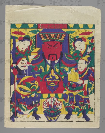 God of War — Guandi; maker, Chinese; nianhua New Year's picture; depiction of the deity Guandi with four acolytes and a sacrificial vessel with treasures; early 20th century, Beijing; graphic print; height 46.5 cm, width 40.0 cm., A colorful print showing a central large figure with a red face and black facial hair wearing an ornate multicolored headdress, flanked by several smaller figures with pale faces and varied headwear; the scene includes decorative elements like stylized clouds and floral motifs in the background, and patterned garments and sashes on the figures. Dominant colors visible are red, yellow, green, blue, purple, and black, with areas of pale cream paper showing around the image edges. The figures hold objects such as a round vessel and a wrapped bundle, and the composition is framed by a rectangular border with a plain outer margin.