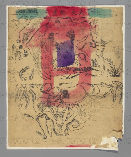 Kui Xing — Patron of writers and scholars; graphic print nianhua, New Year's picture, early 20th century, Beijing; Chinese; height 33.0 cm, width 27.2 cm., A worn rectangular sheet of tan paper with rough edges lies against a gray background, showing faded black ink line drawings of organic shapes and flowing lines that suggest floral or decorative motifs; a broad vertical wash of red-pink paint occupies the center, overlaid by a smaller irregular patch of purple near the upper middle and green rectangles at the top edge, with darker black smudges and faint ink marks scattered across the surface; the paper has creases, small tears and a folded torn corner at the lower right, and areas of discoloration and spotting around the edges.