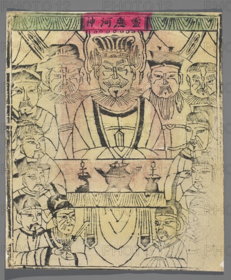 River God, unknown artist, Chinese, nianhua New Year's picture, early 20th century, Beijing; graphic print; height 30.3 cm, width 25.5 cm., The image shows a rectangular paper print with an arrangement of faces and figures drawn in dark ink on a yellowed background with areas of pink and faded washes; central at the top is a large seated figure wearing an ornate headdress and layered garments flanked by several smaller figures with mustaches and beards; below the central figure is a low table or altar holding a teapot-shaped vessel and a few vessel-like objects, with a draped cloth hanging down; surrounding the table are groups of attendants and smaller faces, some holding objects and some with hands together; the border area at the top includes a band with green and pink color blocks and linear decorative patterns, and the whole print shows visible brush or block-print lines, slight smudging, and uneven ink density in black, green, pink, and yellow tones.