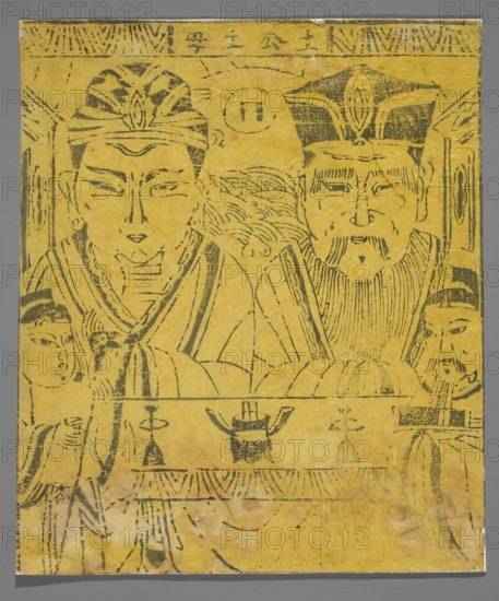 Prince and Mother of the Cultivated Land, Chinese, early 20th century, nianhua New Year's picture, graphic print, height 29.4 cm, width 25.0 cm., A yellow rectangular sheet with black ink line drawings depicting a group of human figures; two large central figures wearing ornate headpieces and robes sit or stand close together, each with stylized facial features and detailed hair or beard lines, flanked by smaller attendants on either side with simpler headwear; decorative patterns and curved lines fill the background and lower portion, including a horizontal band with ornamental motifs and a few object-like shapes on a table in front of the figures; the ink appears slightly faded in places and the paper shows small creases and worn edges, set against a neutral gray backdrop.