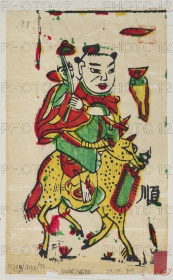 Boy on a mythical qilin, unknown author, Chinese, nianhua New Year's picture, early 20th century, Lingbao place of origin, graphic print, height 18.0 cm, width 10.5 cm; iconography: qilin., A stylized painted figure with a pale face, black hair styled into two buns, and red lips wears layered garments in red, green, and yellow and holds a long staff topped with a rounded element; the figure rides a spotted yellow animal with black spots and a red and green saddle-like decoration, and both are outlined in bold black brushstrokes; the background is a light beige paper with scattered small splashes and smudges of red, green, and black ink, and there are a few small colored shapes near the edges.