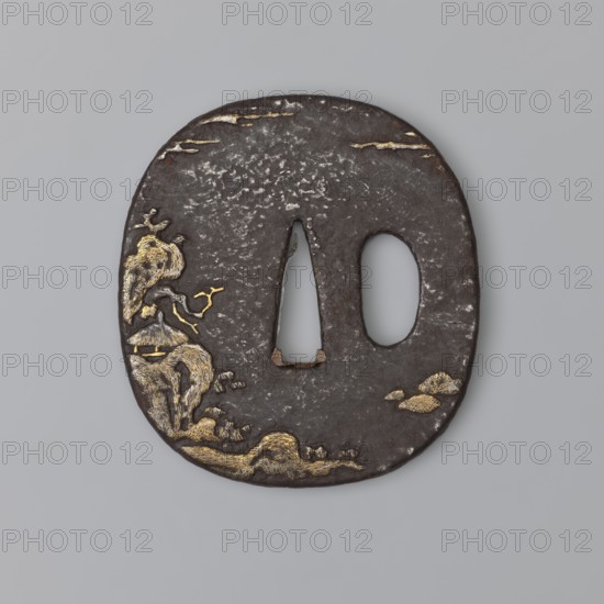 Crossguard tsuba, Japanese, early 19th century Edo period, 1603–1868. Oval tsuba tatemaru gata with a rounded edge maru mimi, decorated on both sides with low and high relief hirabori, takabori landscapes with figures and architecture: on the obverse, sennin Bashiko sitting under a pine tree on the seashore, with a dragon above him in the clouds; on the reverse, a hut on a cliff. Legend has it that Bashiko healed a dragon, and in gratitude the dragon took him to the land of immortality. Unsigned. Materials: metal tsuba. Function: sword crossguard katana. Height 6.6 cm, width 6.0 cm, depth 0.45 cm. Subjects/icons: landscape motifs, waves, dragons, pines, rocks, sennin., A dark brown oval metal object with a rough textured surface and a triangular central opening beside an oval opening; the left side shows a decorative scene in gold tones with organic shapes resembling a tree, curved forms, and cloudlike motifs while the top and lower edges feature scattered gold highlights; the backgrou...
