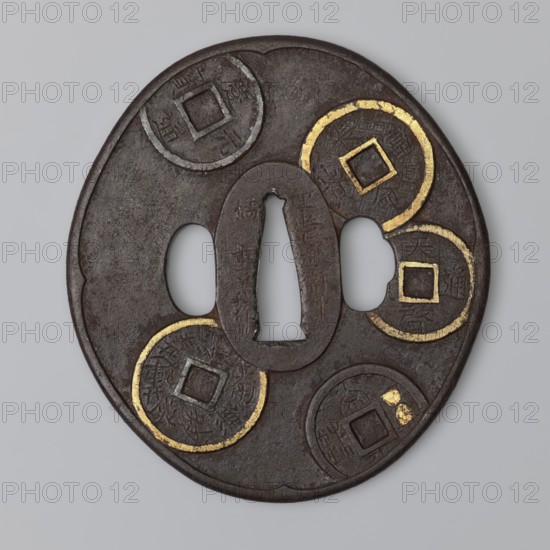 Crossguard tsuba, Umetada school; maker: Umetada Shigeyoshi. Oval tsuba tatemaru gata with a slightly rounded and raised edge of the uchi kaeshi type and seppa dai oval. Decorated on both sides with a relief motif of Chinese coins, details highlighted with gold inlay using the nunome zôgan technique. 1st half of the 18th century Edo period, 1603–1868, Japan. Materials/subject: sword crossguard tsuba for katana; height 8.7 cm, width 7.9 cm, depth 0.3 cm., A round, dark brown metal object with a central vertical oval opening and two adjacent oval cutouts, decorated with a group of circular motifs resembling coins, each with square central holes and several areas highlighted in gold; the surface shows textured, worn patina and subtle variations of brown and gray.