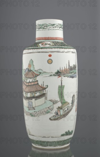 Vase, Chinese, Qing dynasty 1644–1911, colored porcelain, landscape and architectural motifs; Bangping vase from the green family, cylindrical with a shortened neck on a wide, flat ring foot; decorated with the text by Wang Bo entitled Prologue to the poem on the pavilion of Prince Teng and a landscape composition depicting the pavilion and its surroundings; 19th century; vessel; height 40.4 cm, diameter 17.8 cm, weight 2.7 kg., A tall cylindrical porcelain vase with a narrow neck and slightly rounded shoulders stands against a neutral gray background, predominantly white with painted scenes in green, reddish-brown, yellow, black, and pale blue. The neck has decorative green scrollwork and a band of vertical reddish-brown lines, while the shoulder displays a patterned green band with geometric motifs. The main body shows a painted riverscape with a multi-tiered pavilion roofed in reddish-brown and green perched on a pale blue and green stone platform, a traditional sailboat with a larg...