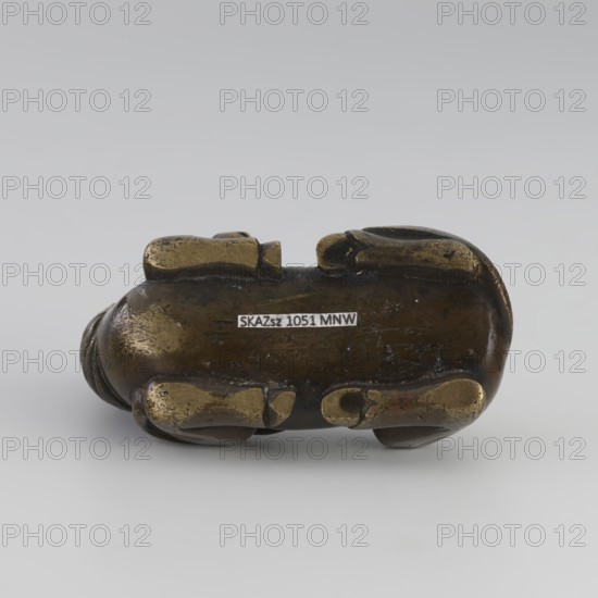 Paperweight — heavenly horse; maker, Chinese; Qing dynasty 1644–1911; 19th century; ceramic/painted sculpture; subject: horse with flames heavenly horse iconography; painting implements; dimensions: height 5.7 cm, width 7.5 cm, depth 4.1 cm., A small sculptural object resting on a neutral gray surface and background, primarily dark brown with areas of worn golden-brass coloration on raised rounded forms; the object has an elongated rounded body with several protruding rounded elements and smooth worn surfaces, showing scratches and patina, and a few darker spots and subtle greenish tints in places.