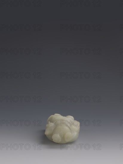 One of the Eight Immortals, Eight Immortals iconography, men, fans, Chinese culture, Qing 1644–1911, 19th century, China, sculpture, height 14.3 cm, width 5.9 cm, A pale green carved object rests near the bottom center of the image on a smooth surface that shifts from light gray in the foreground to darker gray toward the background; the object has rounded, bulbous forms with subtle carved textures and smooth, glossy surfaces, and the overall scene features colors including pale green, light gray, medium gray, and dark gray.