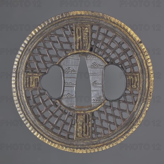 Crossguard tsuba, Round tsuba maru gata in the Chinese Cantonese style, with a distinct, finely fluted gilded edge and a narrow border with a stylized, delicately engraved plant twig. Seppa dai silver, round, decorated with an engraved horizontal stripe motif of stylized groups of trees. Shield decoration is openwork, in the shape of a braid with four cross-shaped rectangles containing ideograms in the style of seal script. Not signed. 18th century Edo period, 1603–1868, Japan. Tsuba; diameter 7.6 cm, thickness 0.5 cm., A round metal object with a lattice-like openwork pattern and a raised textured rim, showing colors of dark brown, gray, gold, and hints of silver; the center has a smooth gray area flanked by two rounded cutouts and a tapered central opening, with a group of rectangular decorative panels around the inner circle that include gold accents; the lattice sections form a repeating geometric grid and the rim has a ridged pattern with worn gold coloring against a gray backgrou...