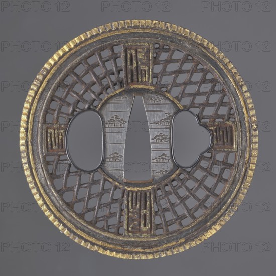 Crossguard tsuba, Round tsuba maru gata in the Chinese Cantonese style with a distinct finely fluted gilded edge and a narrow border with a stylized, delicately engraved plant twig. Seppa dai: silver, round, decorated with an engraved horizontal stripe motif of stylized groups of trees. The shield's decoration is openwork, in the shape of a braid with four cross-shaped rectangles bearing ideograms in the style of seal script. Not signed. 18th century Edo period, 1603–1868, Japan. Tsuba; diameter 7.6 cm; thickness 0.5 cm., A round metal object with a central vertical opening flanked by two rounded openings, featuring an open lattice pattern in the surrounding ring and a textured outer rim; the metal shows shades of dark brown and black with areas of worn gold color and some silvery gray on the central panel, and the background is a flat medium gray.