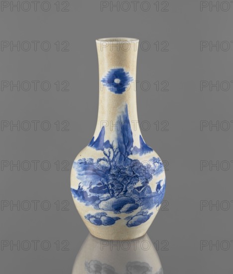 Vase, Paderewski, Ignacy Jan 1860–1941; Chinese, Qing dynasty 1644–1911; ceramics, blue-and-white porcelain with cracklework decoration depicting fishermen and landscape motifs; 19th century; China; vessel; height 23.9 cm, diameter 11.7 cm, weight 0.7 kg., A small ceramic vase with a narrow neck and bulbous body sits against a plain gray background, showing an off-white crackled glaze with blue painted decorative scenes and motifs; the blue includes darker and lighter shades used to depict landscape-like forms, foliage, and organic shapes around the body and a circular motif on the neck, and the vase casts a faint reflection on the surface beneath it.