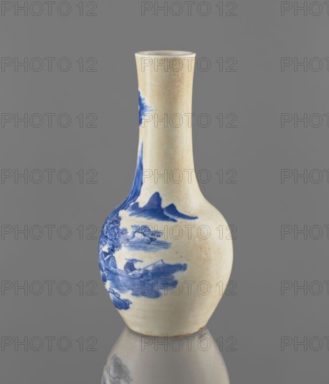 Vase, Chinese, Qing dynasty 1644–1911, 19th century. Blue-and-white porcelain vessel with cracklework decoration depicting fishermen and landscape motifs. Height 23.9 cm; diameter 11.7 cm; weight 0.7 kg., A ceramic vase with a narrow neck and rounded body sits against a plain gray background, showing a crackled cream surface with blue painted landscape motifs; the blue decoration includes stylized mountains, clouds, water, and a small boat scene on the bulbous part, and the vase casts a soft reflection on the surface below.