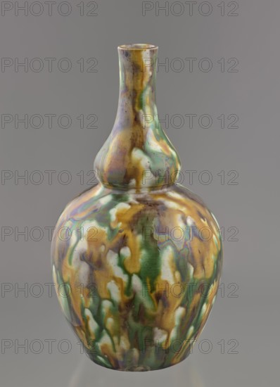 Gourd-shaped vase, Chinese art, Chinese, Qing dynasty 1644–1911, 18th century, China; vessel; height 19.1 cm; diameter 10.8 cm; weight 0.4 kg., A glossy ceramic vase with a bulbous body and a long narrow neck, showing a mottled pattern of green, gold, brown, white, and iridescent purplish hues that blend and drip together across its surface, set against a plain gray background.