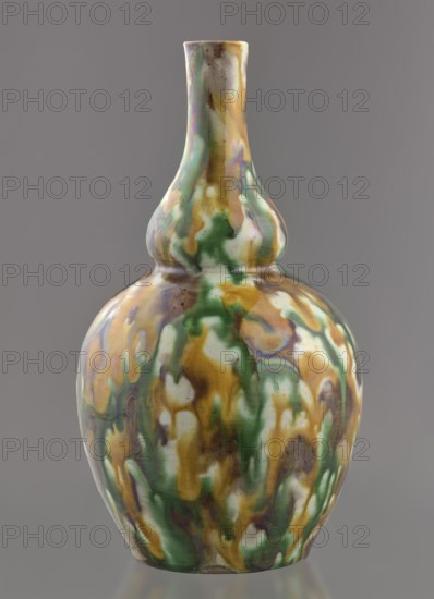 Gourd-shaped vase, Paderewski, Ignacy Jan 1860-1941, Chinese art, Chinese culture, Qing 1644–1911, Qing style, 18th century, China, vessel; height 19.1 cm, diameter 10.8 cm, weight 0.4 kg, A glossy double-gourd ceramic vase with a rounded lower body and a narrow elongated neck, covered in a mottled drip glaze showing green, brown, yellow, white, and subtle iridescent purplish tones, sitting against a plain gray background.