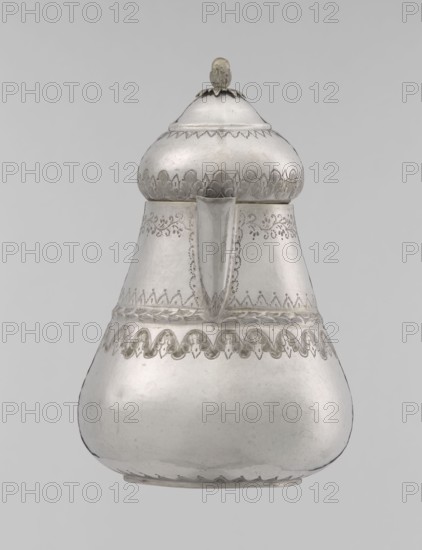 Teapot, Islamic art, Turkish culture, Ottoman dynasty 1299–1922, teapot, jug, geometric motifs, plant ornament, zigzag, lambrequin, plant ornament, 19th century, Turkey, vessel, weight 320 g, height 17.0 cm, diameter 10.9 cm, A metallic vessel with a rounded base that tapers upward into a narrower neck and a domed lid topped by a small knob, shown against a plain light gray background; the vessel surface is predominantly silver with areas of darker gray patina and subtle reflections, and it features decorative etched patterns around the upper body, neck, and just below the midsection forming scalloped and floral-like motifs; a spout projects from the front center, and the lid has a flared rim with a petal-like band beneath the knob.