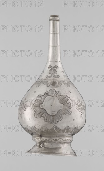Bottle for spraying water soaked in perfumes; creator, Islamic art; vessels with plant and floral ornament; Decoration: multi-leafed undecorated cartouches alternating with small flowers; 19th–20th century; possibly Turkey or North Africa; vessel; weight 113 g; height 17.5 cm; diameter 8.0 cm, A metallic vessel with a long narrow neck and a rounded, bulbous body set on a flared base, rendered in silver and gray tones with darker engraved ornamental patterns; the surface shows floral and scalloped motifs etched around the midsection and near the neck, and a few small decorative clusters on the sides; the base has scalloped edging and a subtle shine with highlights and soft shadows against a light gray background.