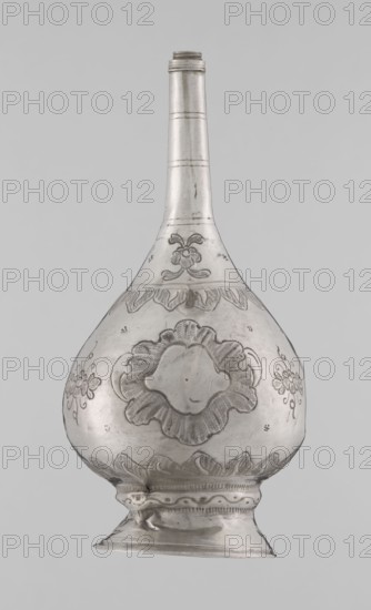 Bottle for spraying water soaked in perfumes, Islamic art, Islamic culture; vessel with plant and floral ornament; decoration: multi-leafed undecorated cartouches alternating with small flowers; 19th/20th century; Turkey, / North Africa ; weight 113 g; height 17.5 cm; diameter 8.0 cm., A metal vessel with a long narrow neck and bulbous body sits against a plain light gray background; the vessel is silver-gray with darker engraved decorative motifs including floral and scalloped patterns around the body and neck, a central raised floral medallion on the bulb, paired floral sprays on the sides, and a patterned base with a flared foot.