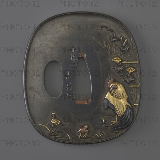 Crossguard tsuba, Suiyôdô, Toshimasa; gift; Japanese art; Japanese; Edo 1603–1868; weapons; cold weapons; swords; katana; sword crossguards; tsubas; plants; flowers; animals; birds; hens; roosters iconography; chicks; chrysanthemums; morning glory; wolfberries. Tsuba in the shape of a rectangle with rounded sides nadegaku gata, katahitsu ana; copper sekigane fillings. Decorated on both sides with high-relief decoration inlaid with multicolored metals, depicting on the obverse a rooster by a fence overgrown with bindweed and a chicken in the grass among flowers; on the reverse a hen with two chicks. 1st half of the 19th century Edo period, Japan. Tsuba; height 6.6 cm, width 5.8 cm, depth 0.3 cm., A rounded square metal object with a dark gray surface shows a carved central opening and a smaller adjacent opening; a decorative scene along one edge features a large rooster rendered with gold and dark blue feathers standing beside gold-accented plants and vines, a small brown chick near the...