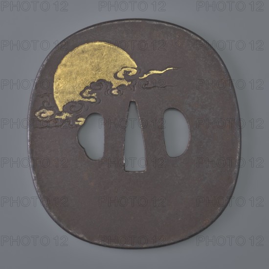 Crossguard tsuba by Senryûsai, Yasumitsu; Ichiryû school; design after a painting by Hanabusa Itchô 1652–1724. Rectangular with rounded corners nadegaku gata and a slightly raised edge uchi kaeshi. Decorated in low relief with the two immortals Jittoku and Kanzan reading a scroll; reverse shows a landscape with a golden sun disc emerging from clouds. Costume details ornamented with gold inlay using the nunome technique. Edo period c. 1801–1830, Japan Mito. Tsuba, height 8.7 cm, width 8.0 cm, depth 0.4 cm., A flat, oval metal object with a dark brown surface and a slightly rough texture is shown against a gray background, featuring a stylized gold semicircular shape near the upper left edge with wispy cloud-like gold embellishments extending from it toward the center; the metal has three elongated openings near the middle, one triangular and two rounded, and there are subtle variations in the dark brown with small areas of rust and patina.