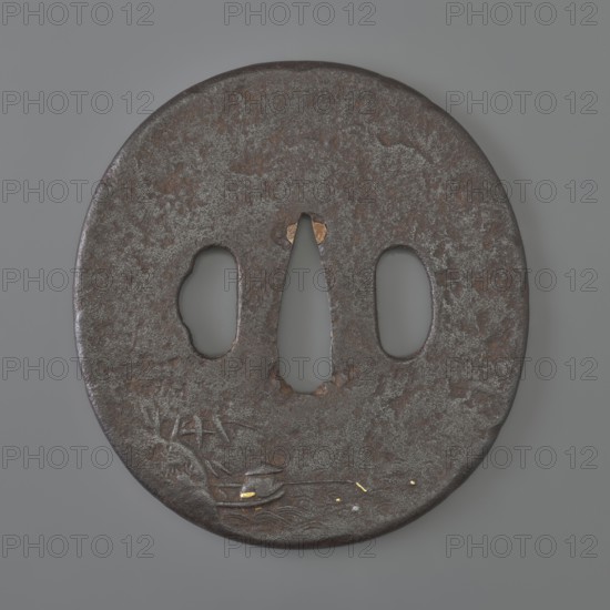 Crossguard tsuba, Kaneie; craftman/school. Oval tsuba tatemaru gata with rounded edge maru mimi. 18th century Edo Period, 1603–1868, Japan — Fushimi, Yamashiro province. Iron tsuba, height 8.0 cm, width 7.4 cm, depth 0.4 cm. Both sides decorated in relief with landscape motifs and figures: obverse shows a wanderer with two calabashes at his belt and a stick standing by a mountain stream; some details face, hands, bottles, binding inlaid with silver, gold, and copper; reverse depicts a fisherman in a boat by a bamboo-covered shore with minor accents inlaid with gold. Subjects: rocks, trees, bamboo, water, fishermen, boats, sea waves; function: sword crossguard katana tsuba., A round, flat metal object with a weathered, textured surface in dark brown and gray tones sits against a smooth gray background; the object has a central elongated cutout flanked by two rounded cutouts, and shows areas of lighter gray patina and small patches of reddish-brown rust, along with a few small accents of...