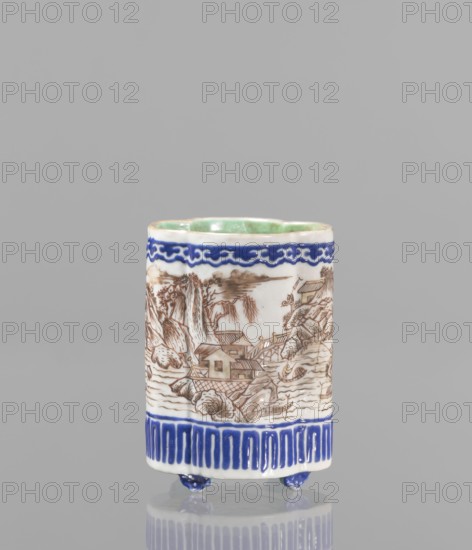 Bowl for tablecloths, ceramics, colored porcelain, fishermen, Chinese art, Qing style, landscape motifs, Chinese culture, incense, geometric ornaments, lambrequin pattern, containers, revindication provenance, Qing 1644–1911, Qianlong 1736–1795, Qianlong style, backdated signatures. Bowl on four small feet. Continuous landscape decoration, bordered at the top and bottom with geometric and lambrequin ornament. 19th century, China, bowl, height 8.2 cm, diameter 6 cm., A cylindrical ceramic cup standing on small rounded feet, predominantly white with hand-painted decoration; the upper interior shows a pale green glaze, the exterior features a deep blue decorative band near the rim and a matching deep blue patterned band near the base, with a brown linear landscape scene wrapping around the middle depicting houses, bridges, rocky formations, and trees rendered in fine brown lines; the small feet are glazed deep blue and the background behind the cup is a uniform light gray.