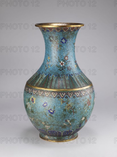 Vase, Qing style, Chinese culture, Chinese art, Qing 1644–1911, chrysanthemums, peonies, plum trees, meander ornament, plant motifs. Vase with a thick, cylindrical neck and a flared spout. 18th/19th century, China. Vessel; height 61.5 cm, diameter 25.7 cm, weight 10.0 kg., A rounded ceramic vase with a flared neck, shown against a neutral gray background, decorated overall in turquoise blue with intricate repeating geometric texture and floral motifs in colors including dark blue, green, white, red, yellow, and gold; the rim and base show metallic gold bands, and a band of scalloped leaf-like patterns in green separates the neck from the belly; scattered stylized flowers and leaves in assorted colors cover the body, and a band of heart-shaped motifs in red and white encircles the upper portion of the belly.