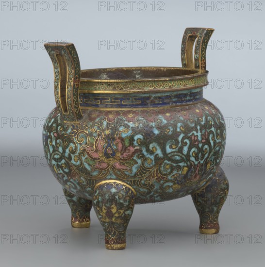 Ding-type incense burner with cover, from Ignacy Jan Paderewski 1860–1941, Chinese, Qing dynasty 1644–1911, Qianlong period 1736–1795, ceremonial ding vessel/censer decorated with lotus plant ornament, 1736–1795, China; height 11.5 cm, diameter 11.0 cm, A rounded tripod vessel with two upright handles, decorated in a dense scrolling floral pattern in turquoise, green, pink, blue, gold, brown, and purple; the body shows stylized flowers and curling vine motifs outlined in gold over a predominantly turquoise and green ground with areas of pink and blue; the rim and handles feature bands and linear patterns with gold accents, and the three stout legs are similarly patterned and tipped with gold; the interior appears darker with metallic tones, and the background is a plain light gray.