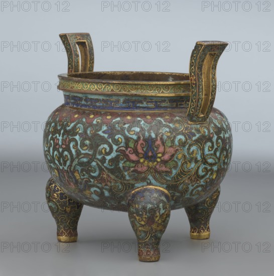 Ding-type incense burner with cover, Chinese, Qing dynasty Qianlong period, 1736–1795, ceremonial ding-type censer decorated with lotus plant ornament, bronze incense burner vessel, height 11.5 cm, diameter 11.0 cm., A rounded tripod vessel with two upward-curving handles, decorated overall with ornate swirling floral and foliate patterns in a palette that includes turquoise, green, blue, pink, red, gold, and touches of purple, set against a darker base; the rim features a band with a geometric border in blue and gold and a scrollwork band in green and gold, while the body displays stylized lotus-like flowers outlined in gold and interlaced scrolling vines; the three short legs continue the same decorative motifs and colors, and the handles are highlighted with gold interiors and green and gold ornamentation on their outer faces; the surface shows areas of worn patina and subtle variations in color and texture.