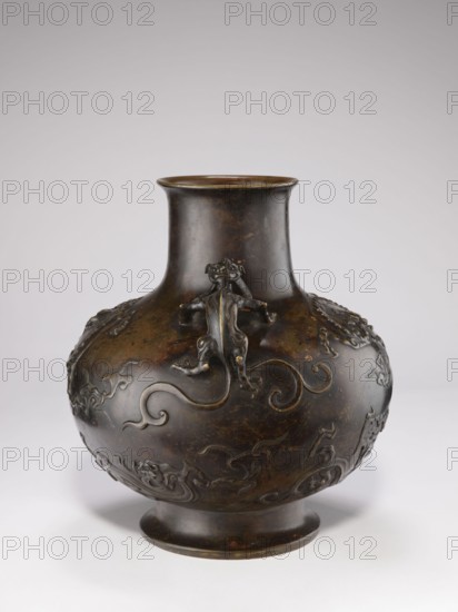 Vase with two dragon-shaped handles qiulong, Chinese; Qing dynasty 1644–1911, 19th century. Porcelain vessel with backdated signatures; belly in the shape of a flattened sphere; low, round foot; cylindrical short neck with a very slightly flared spout; dragons iconography. Height 38 cm; diameter 15 cm; weight 10.0 kg., A rounded bronze vase with a narrow neck and flared rim sits on a short foot; its surface is dark brown with areas of lighter brown and subtle greenish patina, and it is decorated with raised sculptural motifs including a three-dimensional creature clinging to the neck and flowing, curving ornamental patterns wrapping around the body.