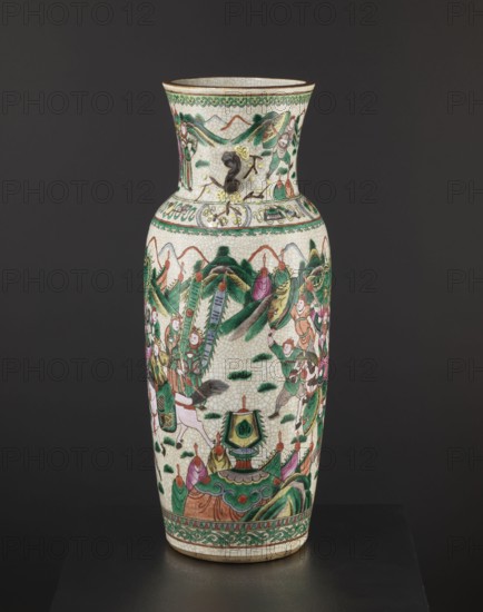 Vase, Chinese, 19th century. Colored porcelain vessel, height 61 cm, diameter 19.6 cm. Slightly tapering toward the bottom with a thick neck slightly flared upward and two small handles shaped like a plum blossom branch. Decoration: elaborate battle scene of warriors on foot and on horseback on the body; a dignitary surrounded by her entourage on the neck; figurative scenes, plant ornaments, horses, warriors, landscapes; decorative vessel., A tall ceramic vase with a flared neck and rounded shoulders stands against a dark background, decorated in a palette of green, white, pink, red, brown, yellow, and black; the surface shows a crackled white glaze with painted scenes of robed figures and stylized foliage wrapping around the body, including several groups of people in green and pink garments, a few birds, and a group of rounded mountain-like shapes in green and brown; decorative bands with scrolling patterns in green and brown appear near the rim and base, and there is a small applied...