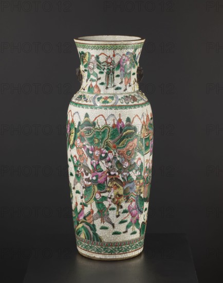 Vase, Chinese, 19th century. Colored porcelain vessel, slightly tapering toward the bottom with a thick neck slightly flared upward and two small handles shaped like a plum blossom branch. Body decorated with an elaborate battle scene of warriors on foot and on horseback; neck shows a dignitary surrounded by her entourage. Figurative scenes, plant ornaments, horses, warriors, landscapes, battles. Height 61 cm; diameter 19.6 cm., A tall ceramic vase with a crackled white ground decorated all over with painted scenes in green, pink, orange, brown, purple, and black; the vase has a flared neck and a bulbous shoulder narrowing toward the base, with decorative green and orange borders near the top and bottom; the main body depicts a crowded scene of many human figures wearing robes and armor, some mounted on horses and some holding banners and weapons, interspersed with stylized green hills and foliage; the neck shows a group of standing figures and decorative motifs, and small sculpted dar...