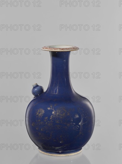 Kendi vessel, Artemisia motif, bottles, ceramics, floral pattern, Chinese art, Qing style 1644–1911, colored porcelain, kendi, reclaimed provenance. Bulbous bottle with a long neck and a flared spout; second spout is bell-shaped at the collar. Border features flowers against a spiderweb background and artemisia leaves on the neck. 18th century, China. Height 23.7 cm; diameter 16 cm., A rounded ceramic vessel with a long narrow neck and a flared rim sits against a plain background, predominantly deep blue in color with a glossy finish and subtle gold-painted floral decorations on its bulbous body; the rim shows a band with a lighter, off-white inner surface and a patterned edge in a reddish-brown hue, and a small protruding spout on the shoulder shares the deep blue glaze with a hint of the lighter color at its tip.