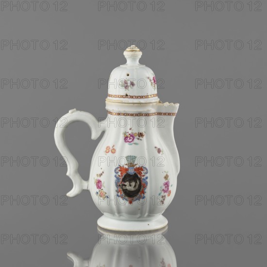 Jug with lid, ceramics with enamel paints, Canton China, Qing style, colored porcelain export piece, 19th century. European decoration: coat of arms with a white griffin on a black field surmounted by four, batons. Function: vessel jug, height 21.2 cm, width 14.4 cm, diameter 10.4 cm., Chinese culture; griffins; teapots; coats of arms; export products., A white porcelain jug with a curved handle and a domed lid sits against a gray background, decorated with small floral motifs in pink, purple, yellow, blue, green, and orange, a central ornate cartouche with blue and red accents surrounding a darker round medallion, gilded trim along the lid edge and rim in gold, and a scalloped spout, the surface showing smooth ribbed contours and a reflective base where the jug's lower edge mirrors faintly.