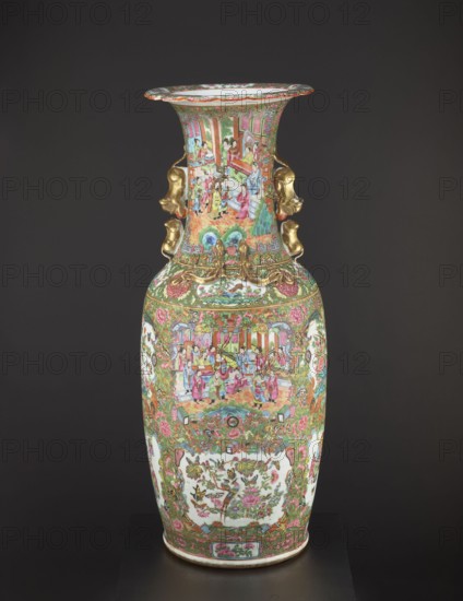 Vase, Chinese, 19th century, China; colored porcelain vessel with figurative court scenes, butterflies, plant and floral ornaments; decorative ceramic vase; height 93.0 cm, diameter 34.0 cm., A tall decorative vase with a flared rim and a narrow neck widening into a rounded body sits against a dark gray background; the vase surface is densely painted with intricate scenes and patterns in bright colors including green, pink, red, gold, blue, white, and black, and features a group of small human figures in traditional dress depicted on the neck and body, floral and foliate motifs, and bird and butterfly imagery in framed panels; the neck has sculpted gold-colored handles in the shape of stylized animal heads and additional gold ornamental details where the neck meets the shoulder; the rim interior appears white, and the base edge shows a thin band of lighter color.