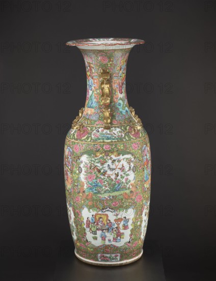 Vase, Chinese, 19th century, China; colored porcelain vessel decorated with figurative court scenes, butterflies, floral and plant ornaments; height 93 cm, diameter 34 cm., A tall ceramic vase with a flared rim stands against a dark background; the vase is covered all over in intricate painted scenes and patterns dominated by green and pink, with additional colors including white, blue, red, gold, and brown. The neck and body display dense floral motifs, scrolling foliage, and framed pictorial panels that show groups of figures and natural scenes painted on white oval cartouches. There are several applied gold-colored decorative mounts around the shoulder and neck, including stylized handles and ornamental fittings. The rim has a patterned border with visible pink and green accents, and the lower body and foot also feature bands of floral decoration and small framed motifs. Overall the surface is richly detailed with a harmonious mix of green, pink, white, blue, red, gold, and brown to...