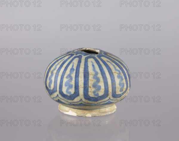 Bottle belly bottle, Abdullazad Mirza Baba fl. ante 1939, Islamic art, Persian culture; glazed ceramic utility vessel decorated with cicadas; 18th century, Iran; height 10.2 cm, diameter 14.1 cm, A small rounded ceramic vessel with a short flaring base and a narrow opening at the top, decorated with vertical elongated petal-like shapes in blue on a pale off-white background; the surface shows crackled glazing and areas of discoloration and wear, and the colors visible are blue, off-white, beige, and hints of brown.
