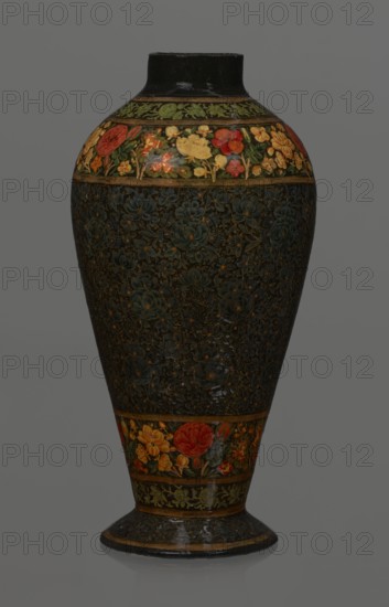 Vase, Qajar dynasty 1785–1925, Islamic art, Persian; lacquer vase, 19th century, Iran. Vessel, height 32.0 cm, diameter 17.0 cm. Decoration: densely placed plant motifs peonies with gold contouring; on the collar and above the foot flowers red and gold. Inside a card no. 54 with an inscription in Italian noting it is a lacquer vase., A tall vase with a rounded body tapering to a narrow base and short neck, featuring an overall dark background with intricate floral patterns; a band near the top and another near the base show brightly colored flowers in red, yellow, orange and green, while the central body area has a dense, textured floral design in deep green and dark tones with small accents of muted gold; the neck and foot rim are dark, and the image background is a neutral gray.