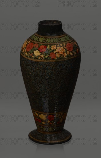 Vase, Qajar dynasty 1785–1925, Islamic art, Persian; lacquer vase, 19th century, Iran. Vessel, height 32.0 cm, diameter 17.0 cm. Decoration: densely placed plant motifs peonies with gold contouring; on the collar and above the foot flowers red and gold. Inside a card no. 54 with an inscription in Italian noting it is a lacquer vase., A tall vase with a rounded body and a narrow neck sits against a plain background, decorated with floral bands and intricate patterns; the top band shows a row of painted flowers in colors including red, orange, yellow, green, and a touch of pink, while the main body displays a dark, textured surface with carved or painted floral motifs in deep blues and blacks with small highlights of gold; a lower band echoes the colorful flowers in red, yellow, and orange above a dark foot that shares the same deep blue and black floral pattern, and the overall visible colors include black, dark blue, green, red, orange, yellow, gold, and pink.