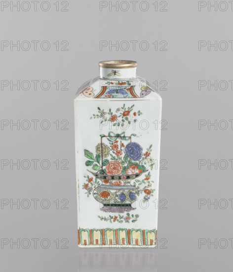 Bottle, vessel, Chinese, 18th century, porcelain, colored decoration, ceramics; decorated on each side with a basket of peonies, four flower sprigs and at the base of the belly a trail of lotus petals; on the shoulders with butterflies, trellises with flower rosettes and sprigs with flowers; on the neck four insects; motifs include peonies, butterflies, floral decorations and insects; height 25.3 cm, width 10.8 cm, depth 10.8 cm., A rectangular porcelain bottle with a short cylindrical neck and a metallic-rimmed mouth sits against a neutral gray background. The bottle is predominantly white with painted floral and decorative motifs in colors including green, orange, red, blue, purple, yellow, and gold. One visible face shows an ornate vase or bowl holding a spray of stylized flowers and leaves, with several blossoms in shades of orange, blue, purple, and yellow and green foliage; small floral sprigs surround the central motif. The shoulder of the bottle has curved panels with multicolo...