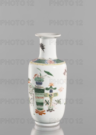 Vase, Qing dynasty 1644–1911, 19th century China; colored porcelain with baigu hundred antiquities ornament; vessel vase, height 20.8 cm, diameter 7.5 cm., A white ceramic vase with a narrow flared neck and rounded body stands against a gray background; the neck is mostly plain white with a small dark brushstroke motif, the shoulder has a band with a green crosshatch pattern and circular floral medallions in pink, and the body is decorated with a few painted motifs in green, orange, pink, blue, and black including stylized floral arrangements, leaf shapes, and geometric vessel-like forms.
