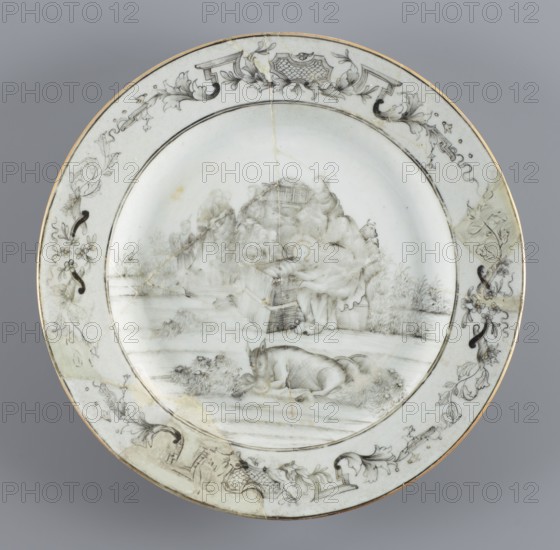 Plate with a scene of the adoration of the Holy Family the shepherds' adoration., Chinese, Qing dynasty 1644–1911, 18th century. Porcelain export plate painted in iron oxide black Chinese ink/soot. The plate depicts the popular export-porcelain motif of the arrival of the shepherds to the Bethlehem stable; iconography includes the Holy Family and the shepherds' adoration; Jesus Christ. Vessel; height 2.2 cm, diameter 23.0 cm, weight 0.37 kg., A round ceramic plate with a pale grayish-white background and a thin gold rim, decorated with delicate monochrome gray and black line drawings; the central scene shows a group of figures seated and standing amid draped fabric and architectural elements, with one reclining animal in the foreground and grassy foliage around the scene, while the wide border features scrolling floral and foliate motifs, ornamental cartouches, and ribbonlike flourishes in gray and black.
