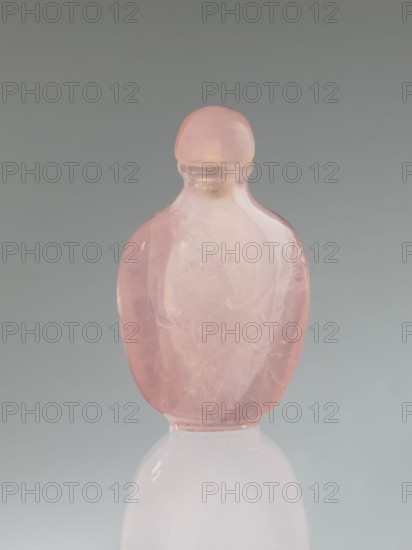 Snuffbox with spoon, decorated with flowers and dragonflies, Chinese art, Chinese culture, Qing dynasty 1644–1911, 19th century, China, vessel; height 7.4 cm, width 4.4 cm, depth 2.5 cm., A smooth, translucent rounded bottle with a rounded stopper, both made of pale pink material, standing upright on a reflective pale surface; the bottle shows internal cloudy inclusions and subtle carved or etched marks, and the background is a gradient of soft gray tones.