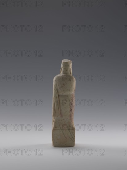 Sage with a Fan, 19th century, Qing dynasty 1644–1911, China; sculpture of a male figurine holding a fan; height 16.1 cm, width 4.4 cm, depth 4.3 cm., A slender carved stone figure seen from behind standing on a rectangular base, with a smooth rounded back, a draped sleeve hanging along one side, and a simple head covering; the surface shows mottled tones of pale green, beige, and light brown with some reddish-brown spots and darker grayish streaks, set against a gradient background that transitions from dark gray at the top to lighter gray near the bottom.