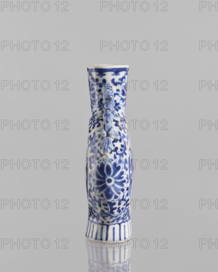 Bian hu moon pilgrim bottle, noted, 17th century China, blue and white porcelain vessel decorated with figurative scenes of circus performers, floral tendrils and plant ornaments; height 15 cm, diameter 3.5 cm., A narrow ceramic vase with an elongated neck and rounded body standing upright, decorated with an intricate floral and scroll pattern in blue on a white background, showing a raised sculpted element resembling a small figure or ornament attached near the neck; the base has vertical blue stripes, and the object is reflected faintly on a smooth surface; visible colors include blue, white, and gray from the background.