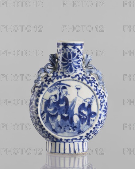 Bian hu moon pilgrim bottle, 17th century China, blue-and-white porcelain vessel decorated with figurative scenes of circus performers, floral tendrils and plant ornaments; height 15 cm, diameter 3.5 cm., A small round ceramic vessel with a short cylindrical neck and a flattened base, decorated in blue on a white ground; the body shows a circular painted scene with a group of people wearing flowing garments, and the neck and surrounding areas feature floral and scrolling motifs; there are sculpted dragon-like handles on either side of the neck, and the base edge has vertical banding; visible colors include blue and white, with subtle gray reflections from the surface.
