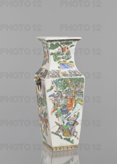 Vase, Chinese, 18th century, porcelain with polychrome enamel decoration, figurative genre and battle scenes, vessel, height 31.2 cm, width 11.0 cm, An upright hexagonal porcelain vase with a flared square rim, decorated all over with painted scenes and motifs in colors including green, blue, orange, red, yellow, and brown on a white ground; one visible side shows figures in flowing robes engaged in action among trees and banners, another side shows figures seated under trees, and the panels are separated by decorative bands with floral and geometric patterns; a small sculpted ring handle appears on one corner, and the base edge is finished with a narrow multicolored border.